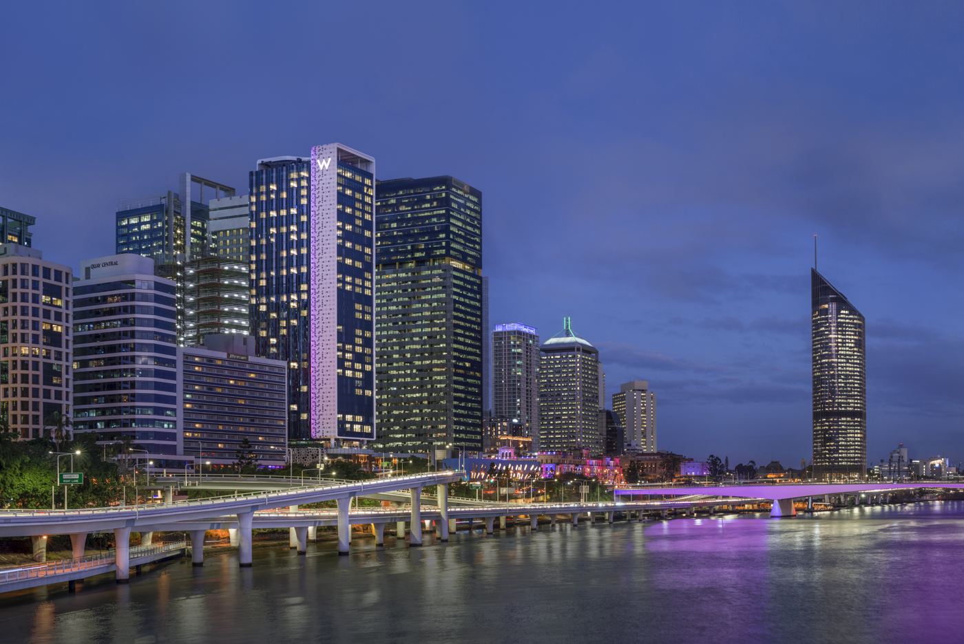 Photo of buildings along the Brisbane River waterfront, with the W hotel featured in the middle